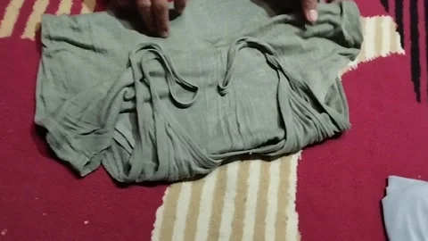 Folding singlet shirt Stock Footage 218236231