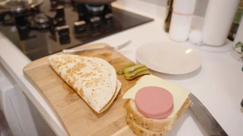 Folding the Tortilla Wrap with a Spatula, Preparing to Cook Another Batch. Stock Footage 280012196