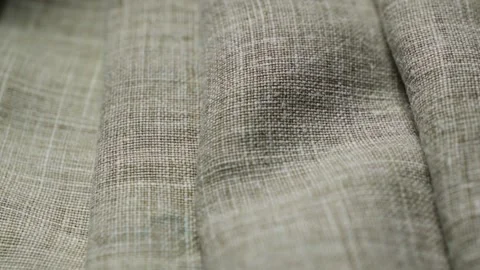 Folds on a natural linen texture background. Abstract thread pattern on a linen  Stock Footage 208113134