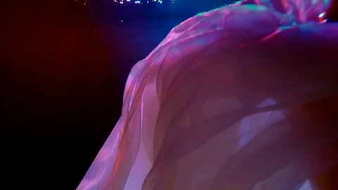 Folds of pink translucent fabric move beautifully in the dark water. blue and 스톡 동영상 123199783