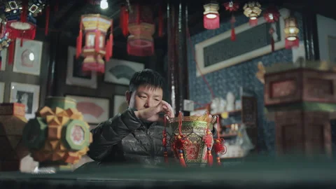 Folk artists make lanterns in a shop, Zhejiang, China Stock Footage 141013997
