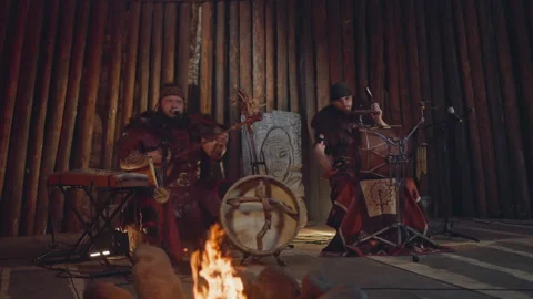 Folk band performs on stage decorated with rough logs Stock-Footage 201072623