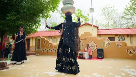 Folk dancer moves on stage pots over her head Stock Footage 295923432