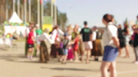 Folk enthusiasts enact ring dance during daytime fair. Stock Footage 311642418