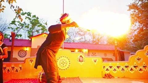Folk Fire Performer Twirls Flames dancing in Rural area Stock Footage 313279554