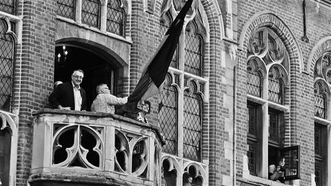 Folklore in Belgium : hurlu doll throw from the city hall of Mouscron Stock Footage 90376726