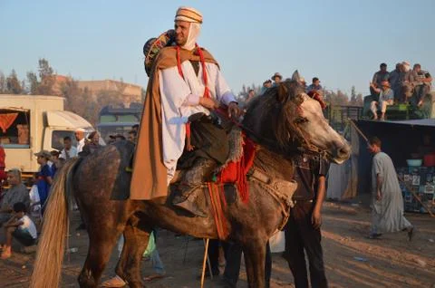 Folklore man riding his horse in Algeria Stock Photos