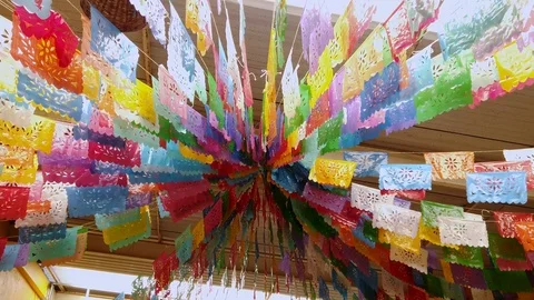 Folkloric decorations hanging from the sealing from a store in Puebla, Stock Footage 108571542