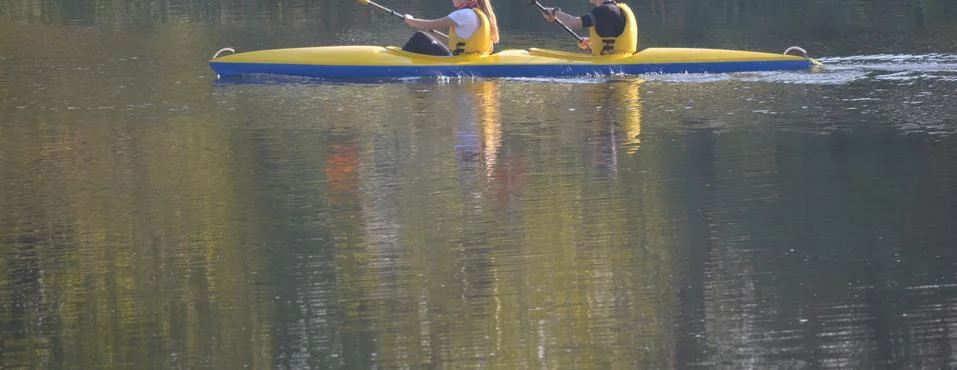 The folks at Canoe float down the River in summer individuals are not visible 2 Stock Photos