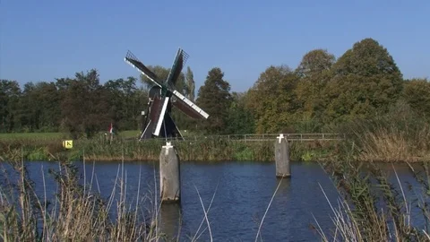 Follega windmill spider mill along the Oude IJssel river Stock Footage 73240791