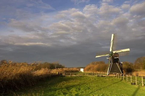 The Follega windmill under a heavy clouded sky Stock Photos