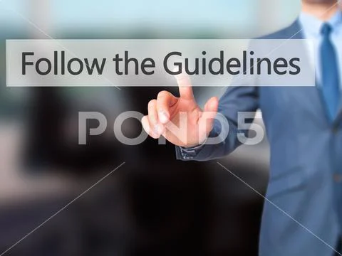 Follow the Guidelines - Businessman hand pressing button on touc Stock Photos