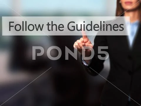 Follow the Guidelines - Businesswoman hand pressing button on to Stock Photos