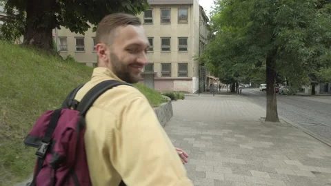 Follow me concept man backpacker holding hand of girlfriend leading way to city Video stock 146278882