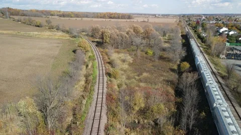Follow the railroad into the fields Stock Footage 141342613