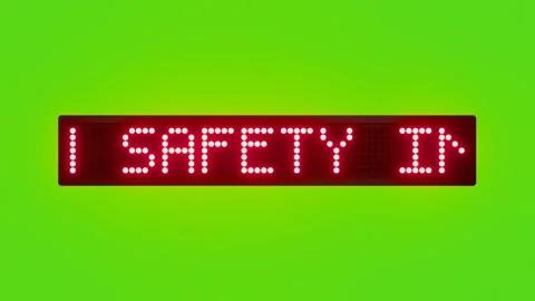 FOLLOW SAFETY INSTRUCTIONS Scrolling Red Dot Matrix LED Text Animation on Green Stock Footage 317365285