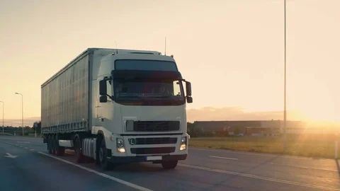 Follow-up Shot of a Semi-Truck with Cargo Trailer Moving on a Highway. Stock Footage