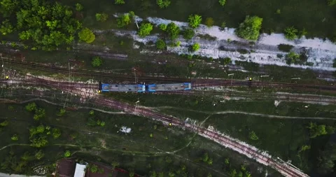 Follow Shot Of Small Train Composition Going Through Swamp Area Tracking Aerial Stock Footage 300442092