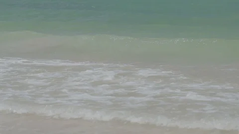 Follow Slow Motion Waves Up Sandy Beach Stock Footage 100985463