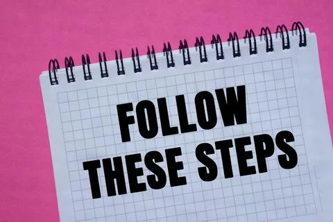 Follow these steps message written on notebook page on pink background. Con.. 스톡 사진