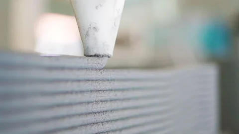 Follow through shot Extra Close up Cement Printing Machine is printing layer Stock-Footage 243976085