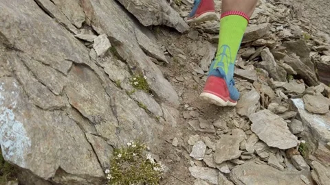 Follow view of sky-runner running high in the mountains. Stock Footage 138577563