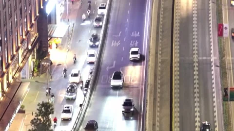 Follow white car ride multi level road. Urban highway. Multilevel interchange. 動画素材 330466974