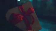 Follow Young Caucasian Male Carries A Present White Gift Box With Red Ribbon Bow Stock Footage