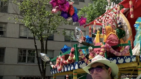 Followers of Hare Krishna at parade with float in New York City NYC Stock Footage 112074517
