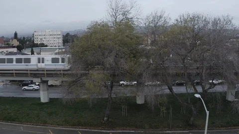 Following the Bart train in Oakland Stock Footage 121939550