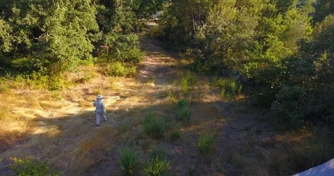 FOLLOWING THE BEEKEEPER AERIAL VIEW Stock Footage 95093699