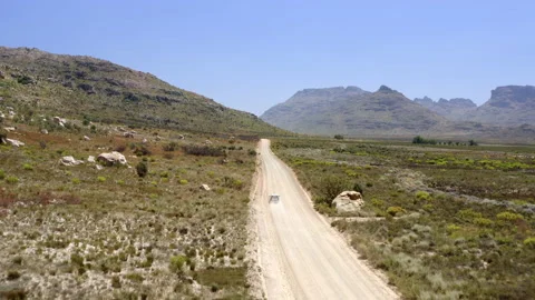 Following Car Through Empty Dusty Mountainous Road Stock-Footage 133240713