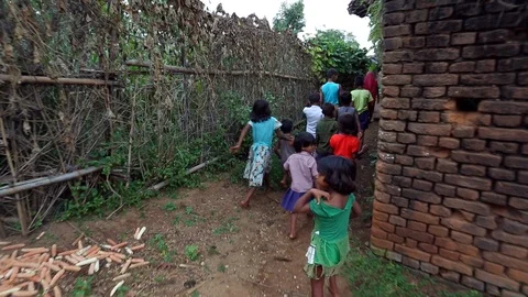 Following children through a village in rural IndiaStock Footage