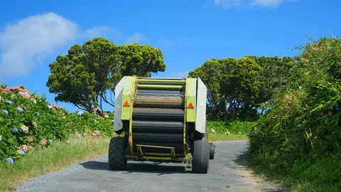 Following a Corn thresher tractor on the road. Faial Island, Azores, Portugal Stock Footage 116464892