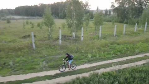 Following a cyclist from a drone Stock Footage 161322517