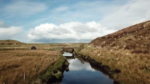 Following the flow of an Irish River Stock Footage 137946311