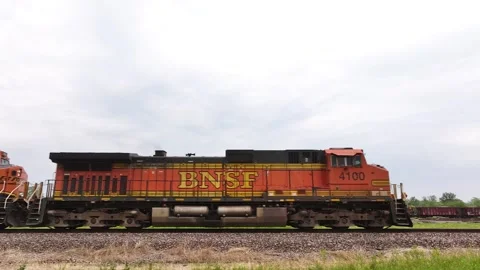 Following a freight train on a railroad. Stock Footage 243589354