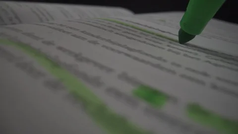 Following green marker marking text in book education macro closeup Stock Footage 124015057