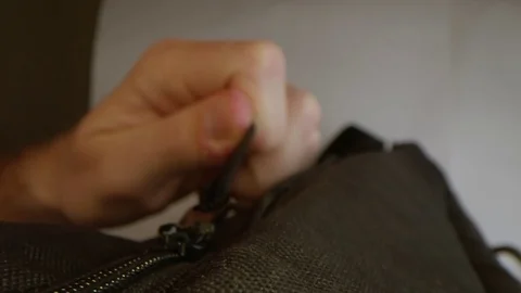 Following macro zipper pulling. Opening bag. Stock Footage 109259721
