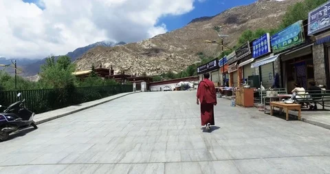 Following a monk through Sera Monastery Stock Footage 93054946