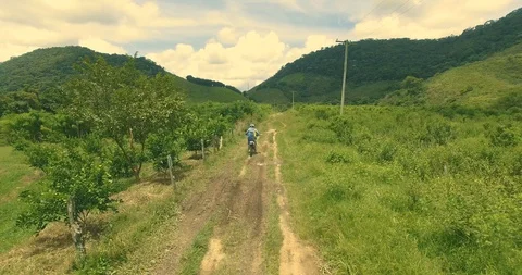 Following a motorcycle on a trail Stock Footage 86194201
