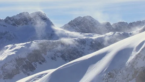 Following up a mountain ridge with powerful wind blowing away the snow Stock-Footage 101898312