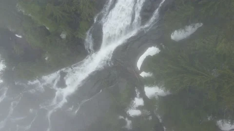 Following a Mountain Waterfall Through a Cloud 스톡 동영상 192704359