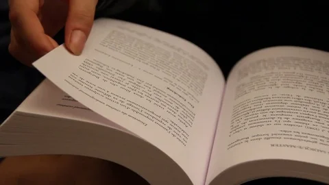 Following page turn in book Stock Footage 79048284