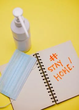 Following protocol carefully. Studio shot of covid equipment against a yellow Stock Photos