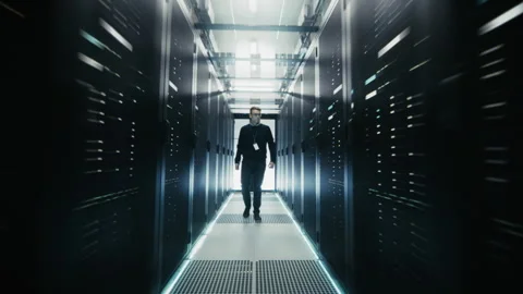 Following Shot IT Engineer Walking In Data Center Stock Footage 320999643