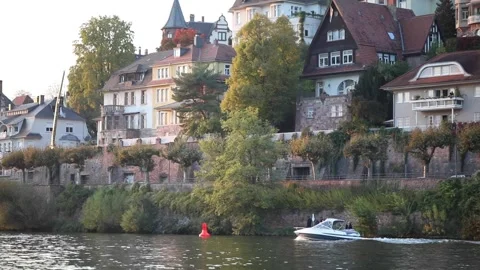 Following shot of a small boat while sailing through Neckar river Stock Footage 171083254