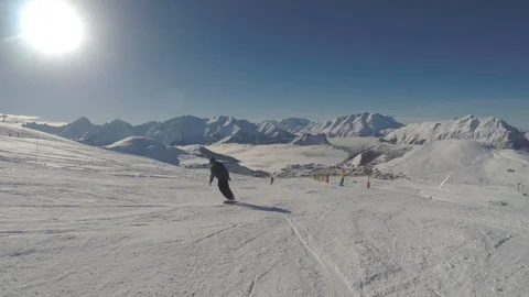 Following snowboarder down mountain 動画素材 86482367