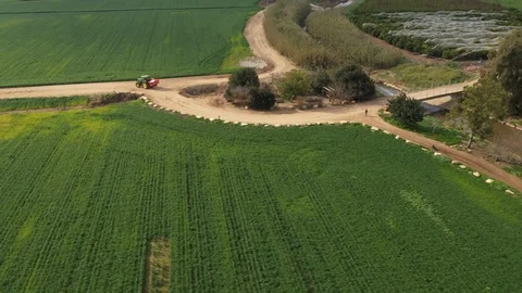 Following tractor in fields Stock Footage 125912303