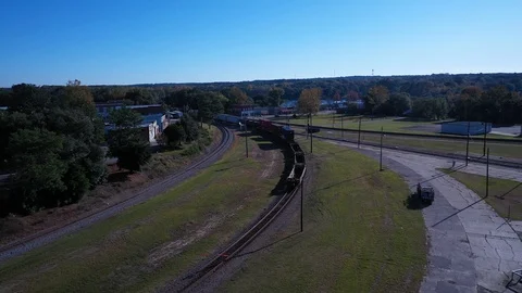 Following a train from above as it goes around a corner Stock Footage 119704672